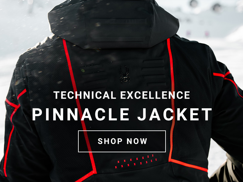 Backside detail of black and red technical ski jacket. Message: Technical Excellence. Pinnacle Jacket. Shop Now.