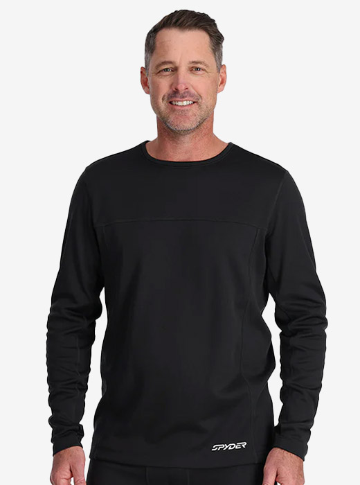 Man in studio wearing a black Spyder baselayer with logo