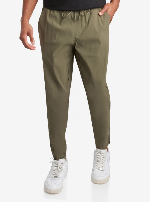 Male model waist down photo of Spyder Track Pants with a light grey studio background