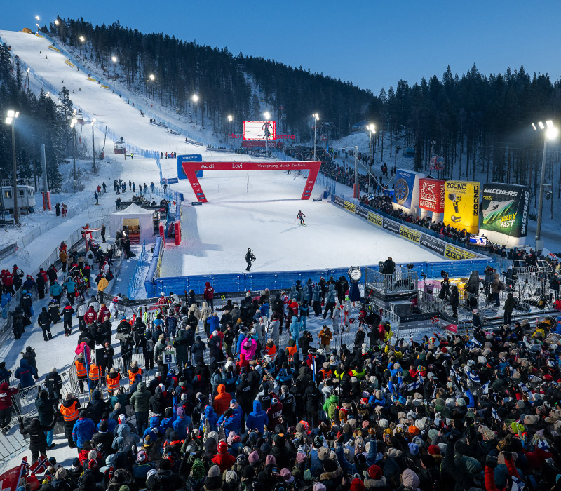Image of a finish line with a crowd.