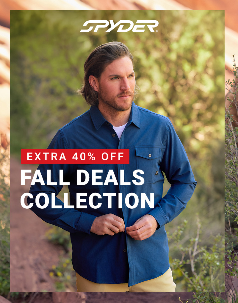 Spyder logo. Man buttoning up a navy long sleeve shirt in a forest setting. Message: Extra 40% Off Fall Deals Collection