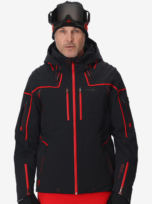 Studio image of model wearing a black and red Pinnacle Jacket