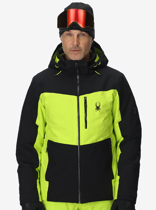 Man wearing a black and lime ski jacket