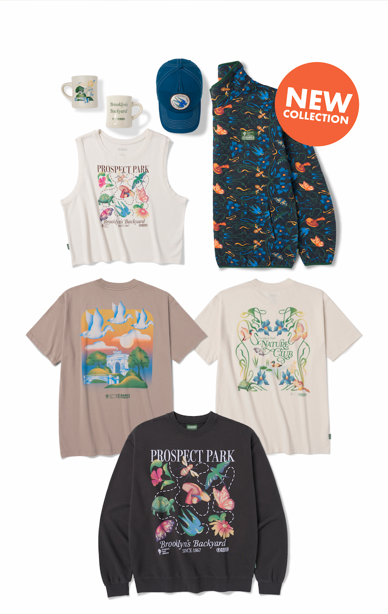 A grouping of Prospect Park x Parks Project collection pieces on a white background, including a blue floral-patterned cap, a white ceramic mug, a white muscle tank with a Prospect Park graphic, a blue floral button-up fleece, a tan t-shirt with a colorful park landscape graphic, a cream t-shirt with a botanical illustration graphic, and a dark charcoal crewneck sweatshirt reading "Prospect Park – Brooklyn's Backyard." An orange badge reads "New Collection."