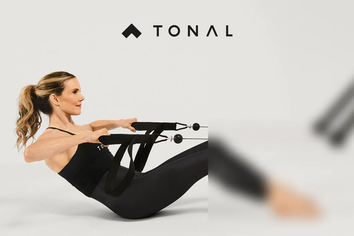 A woman working out with Tonal