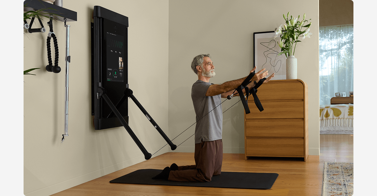 A man working out with Tonal 2