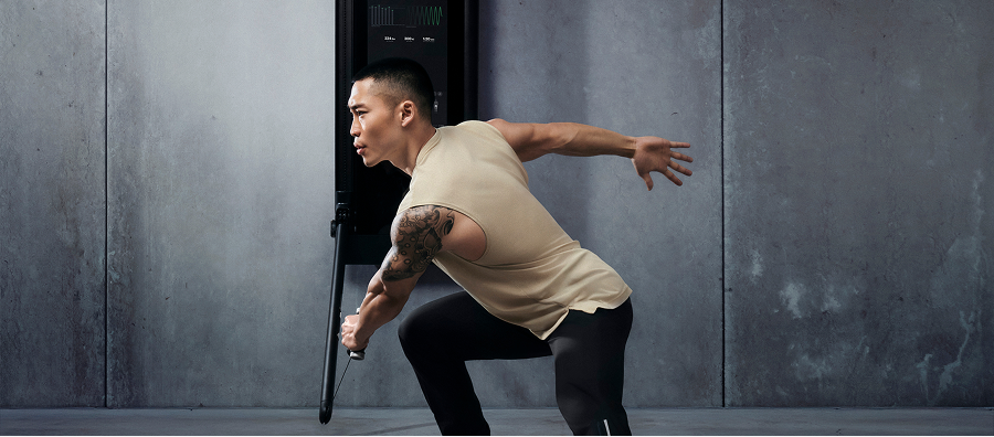 A man working out with Tonal 2