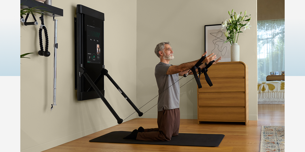 A man working out with Tonal 2