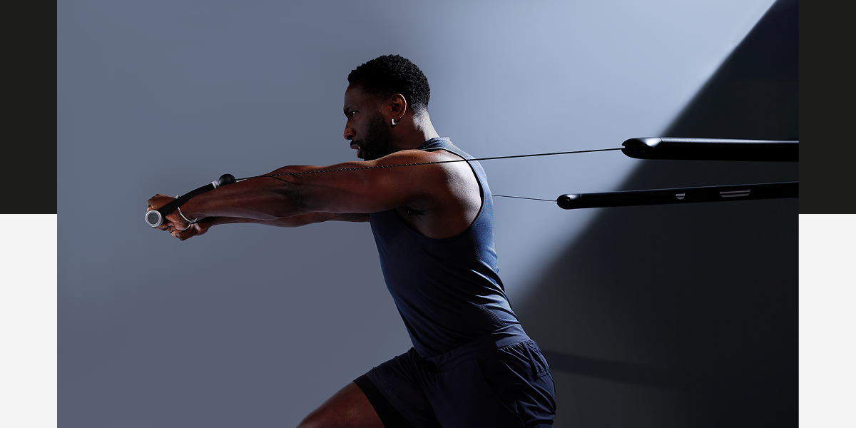 A man working out with Tonal 2