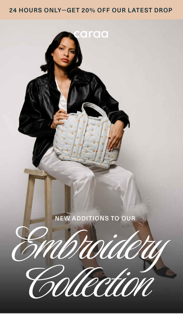 an image of a woman sitting on a stool holding a bag