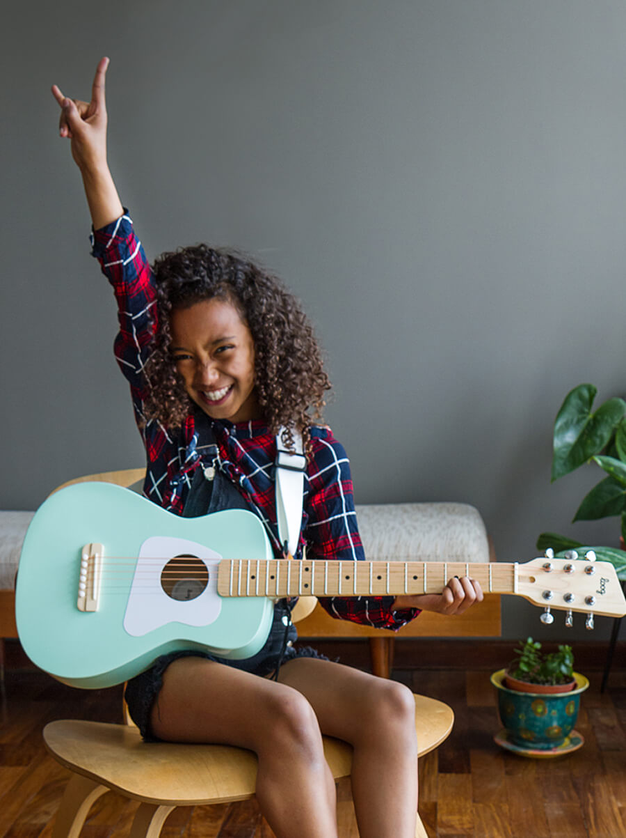 kid playing guitar