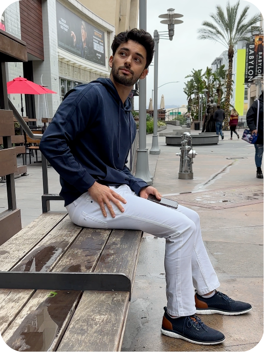 Candid shot of a Navy Perfect Hoodie paired with Slim fit Blancos