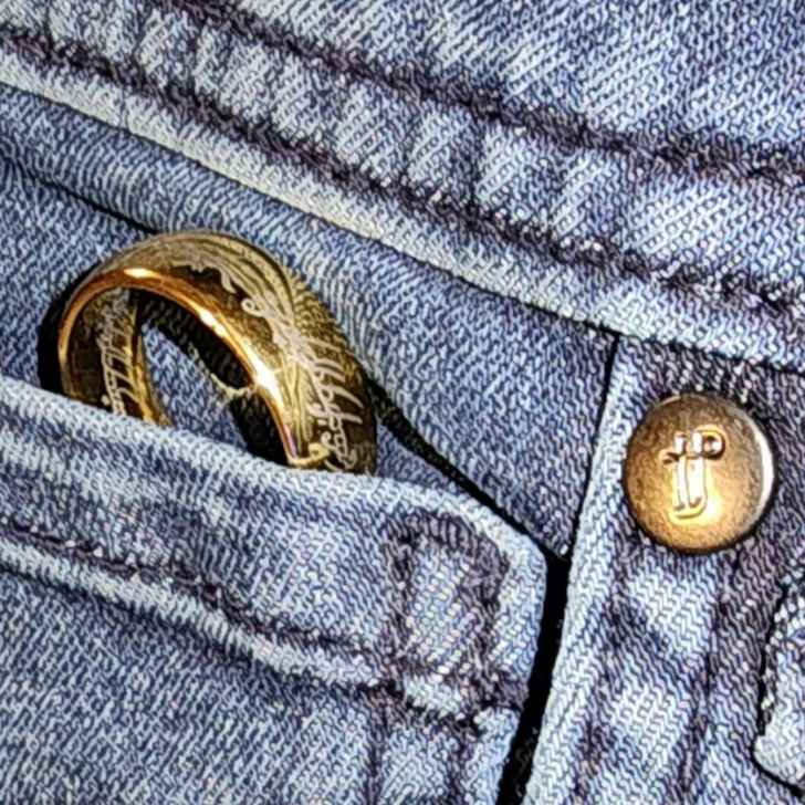 The One Ring peeking out of the watch pocket on a pair of Slim Knights