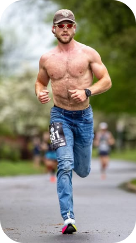 Truett running the Knoxville marathon in Athletic fit Cowboys