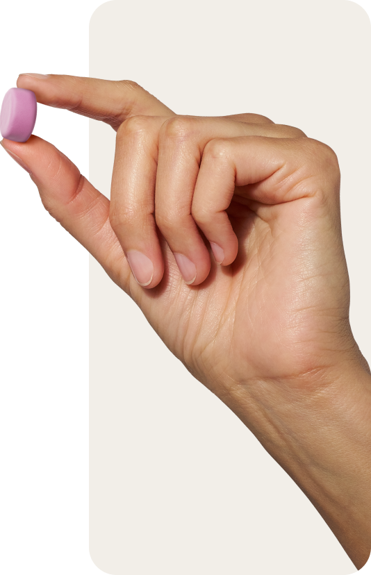 Hand holding a Creatine Monohydrate Gummy