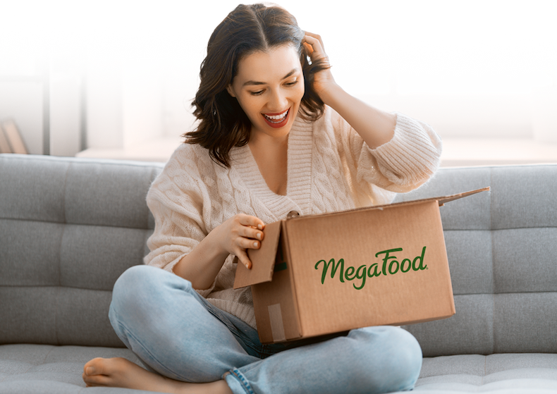 Woman with MegaFood shipping box