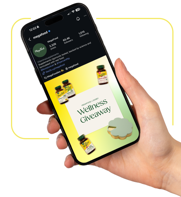 Hand holding a mobile phone on MegaFood's Instagram post