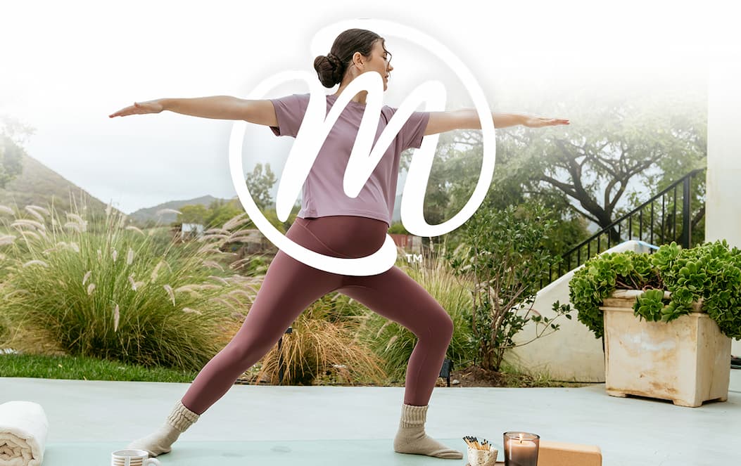 Woman doing yoga wrapped with the MegaFood M monogram