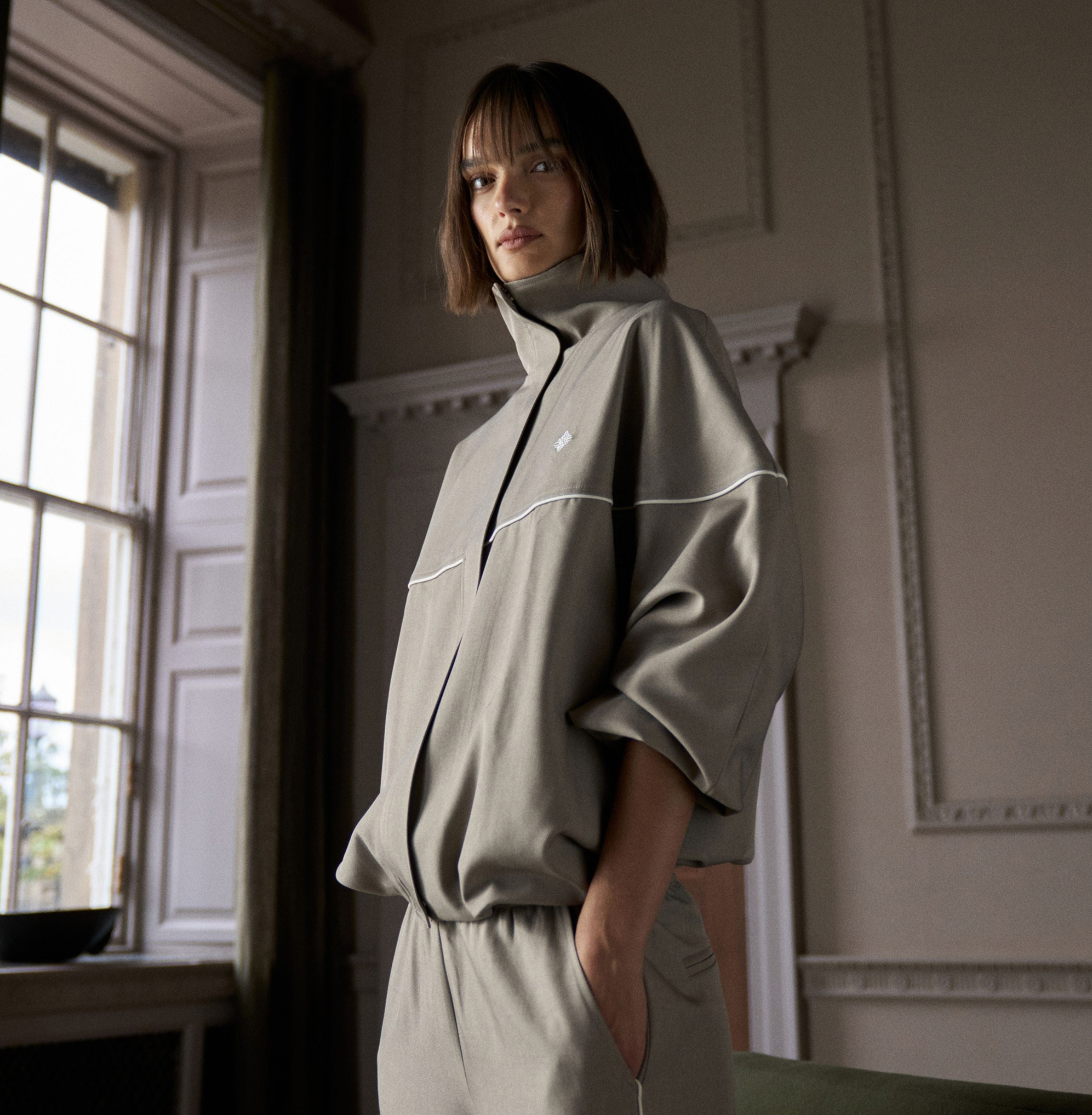 PIPED FUNNEL NECK TRACK JACKET