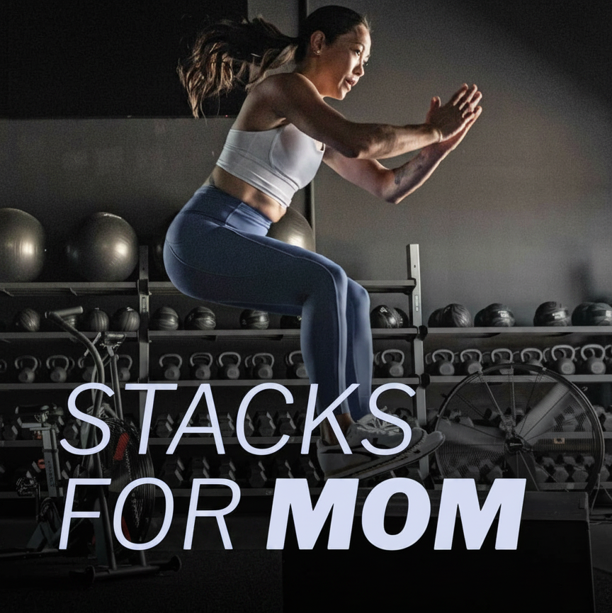 Woman jumping in a gym with "STACKS FOR MOM" text.