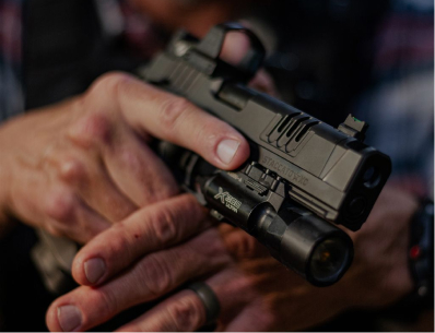 Picture of person holding a Staccato XC with Surefire X300