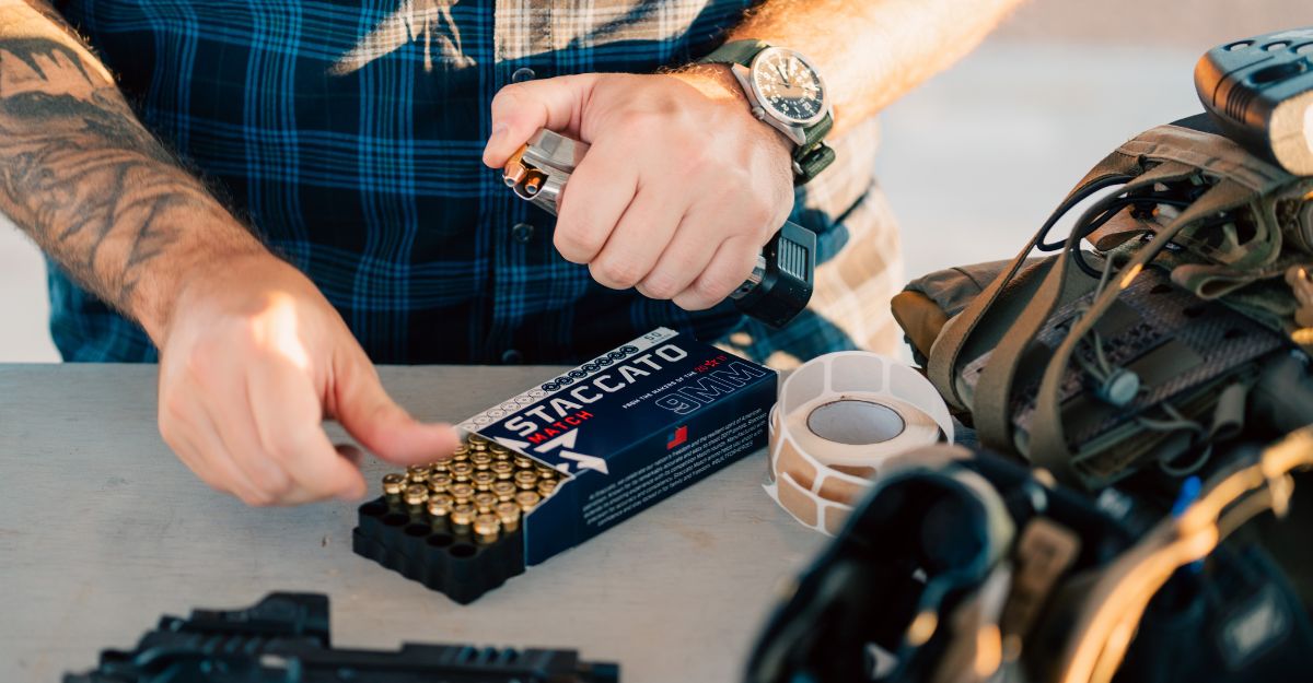 picture of person loading magazine with ammo