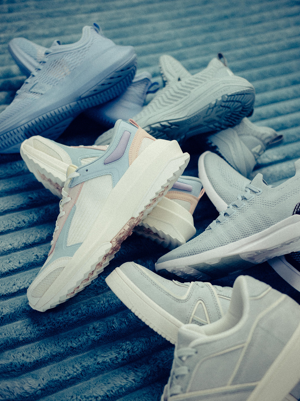 an image of a pile of shoes on a metal surface