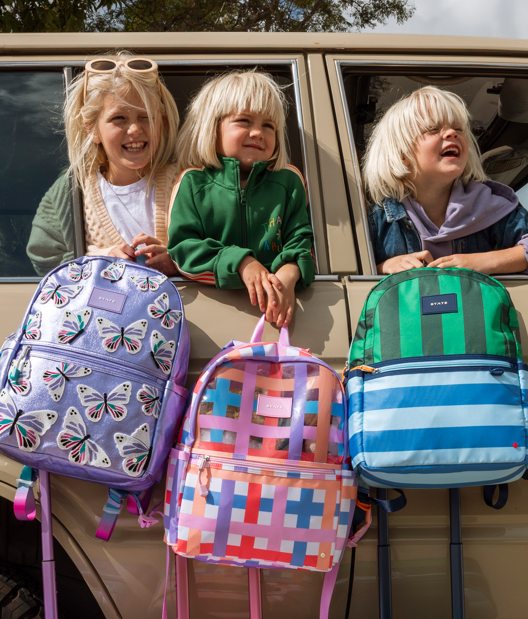 Kids holding STATE Bags