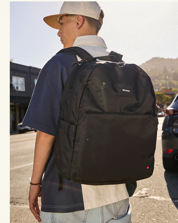 Boy wearing Reed backpack Black
