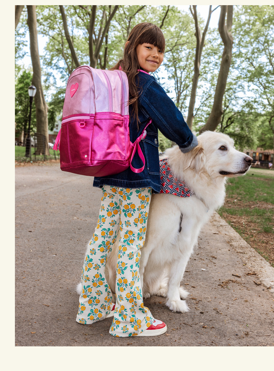girl wearing STATE Bags best selling backpack 