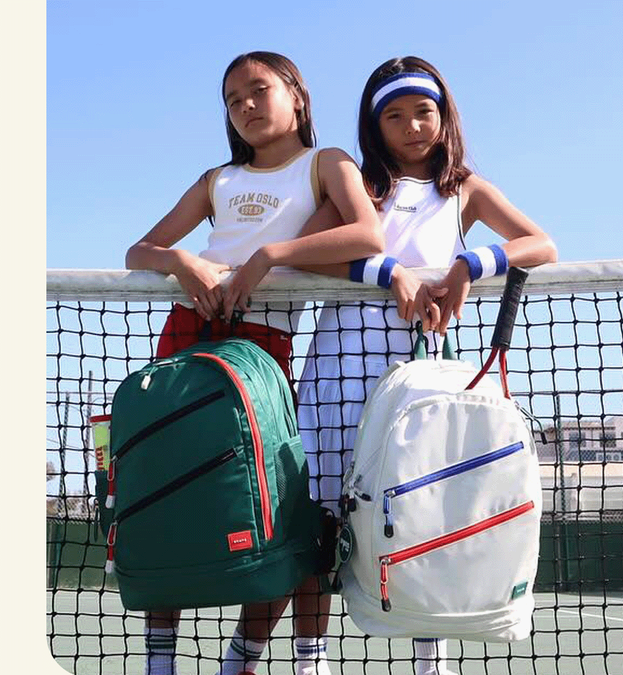 Girls holding STATE Bag's Lenox Tennis Bags