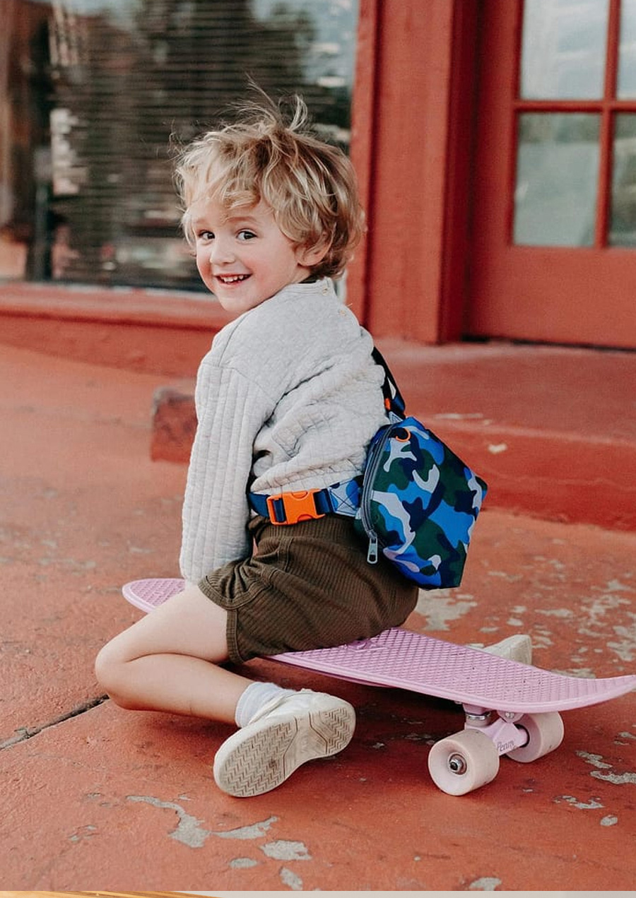 boy wearing camo fanny pack
