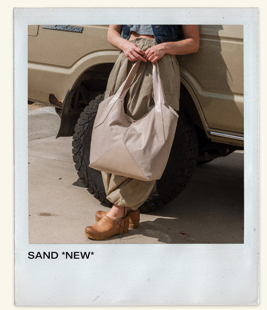 Woman holding Beverly Tote Sand