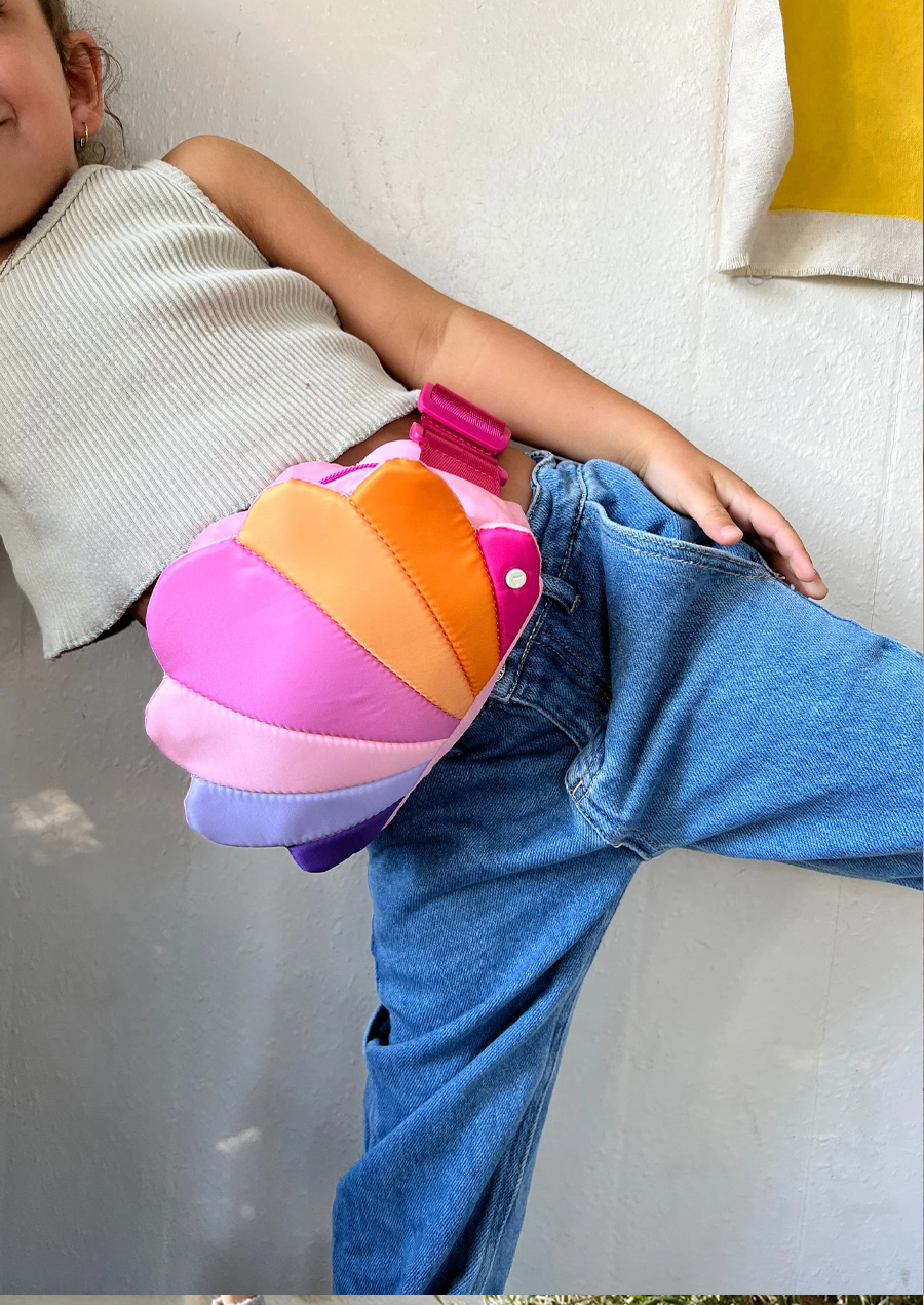girl wearing seashell fanny pack