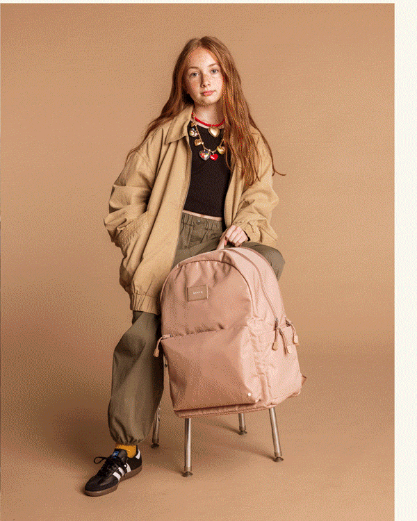 Boy wearing Reed backpack Mocha