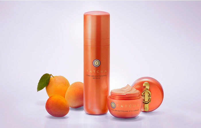 An image of the Tatcha Brightening Serum and the Brightening Eye Cream amongst some Japanese plums.
