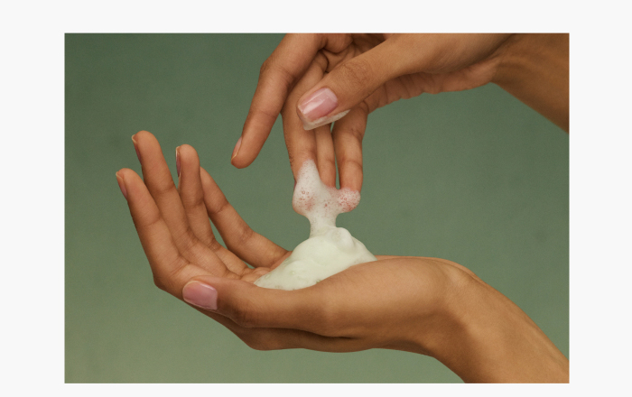 An image of hands with foam from The Matcha Foam Cleanse