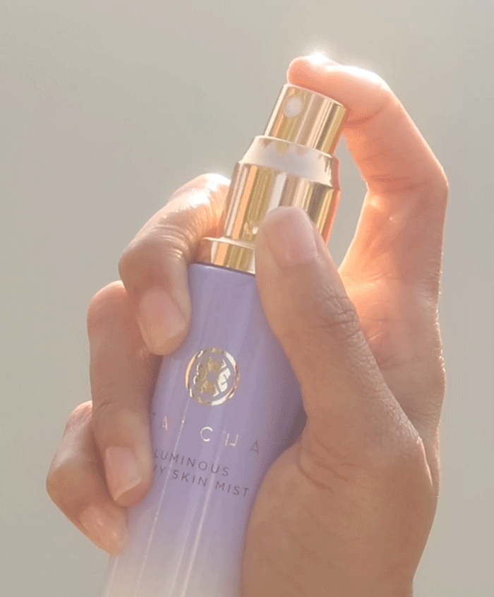 A gif of the Tatcha Luminous Dewy Skin Mist spraying continously, showcasing the mist effect and atomizer.