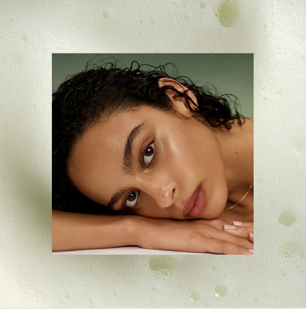 An image of a model showing the hydrating skin finish of The Matcha Foam Cleanse