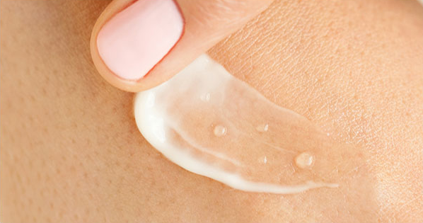 A finger swatching the Tatcha Dewy Serum with the highlighted ingredient of hyaluronic acid.