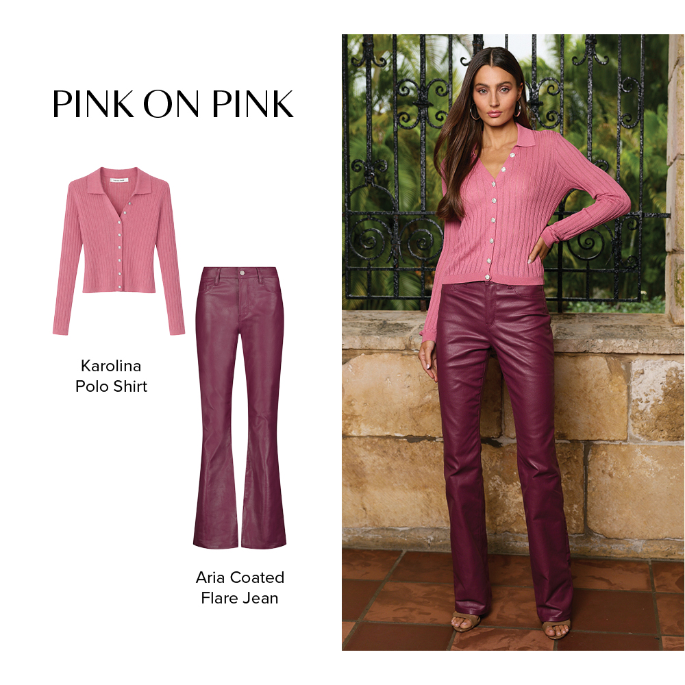 Pink on Pink. A model is posed in a stone corridor wearing the Petal Pink Karolina Polo Shirt and Sangria Aria Coated Flare Jean.
