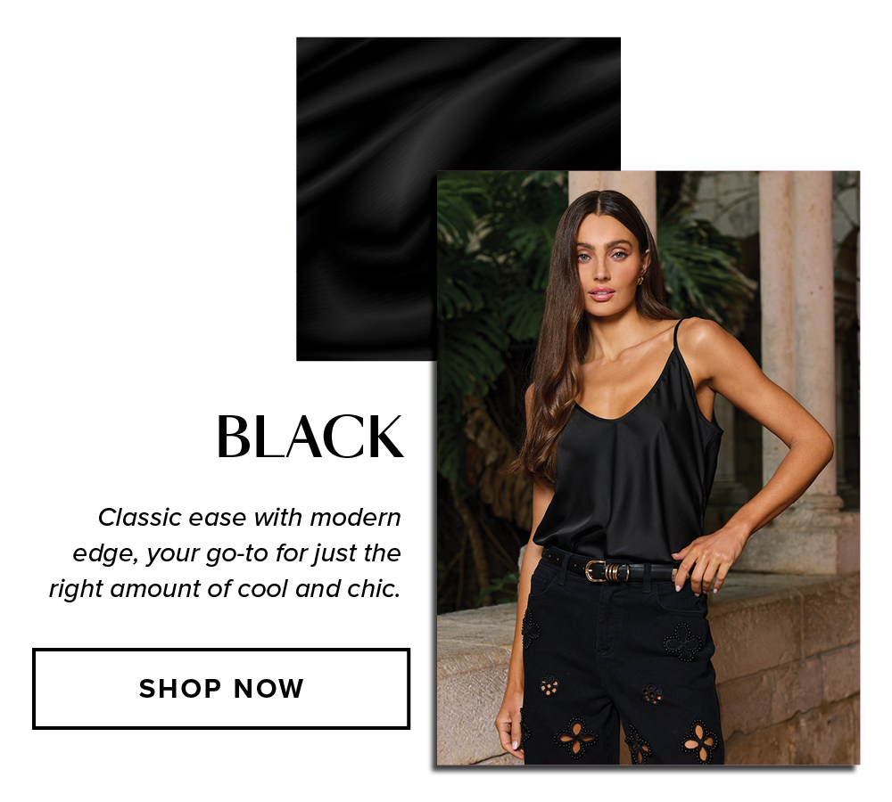 Black. Classic ease with modern edge, your go-to for just the right amount of cool and chic. An image of a model wearing the Yara Silk Camisole in Black in a stone corridor with greenery behind her.