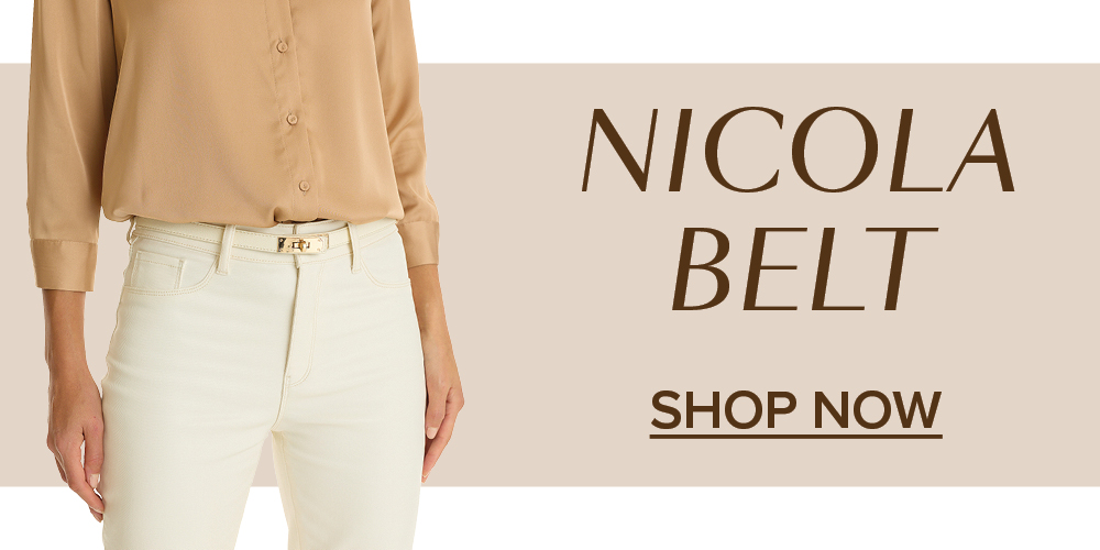 Nicola Belt. Shop Now. A model stands to the left behind a beige background wearing the Bronze Nicola Belt.