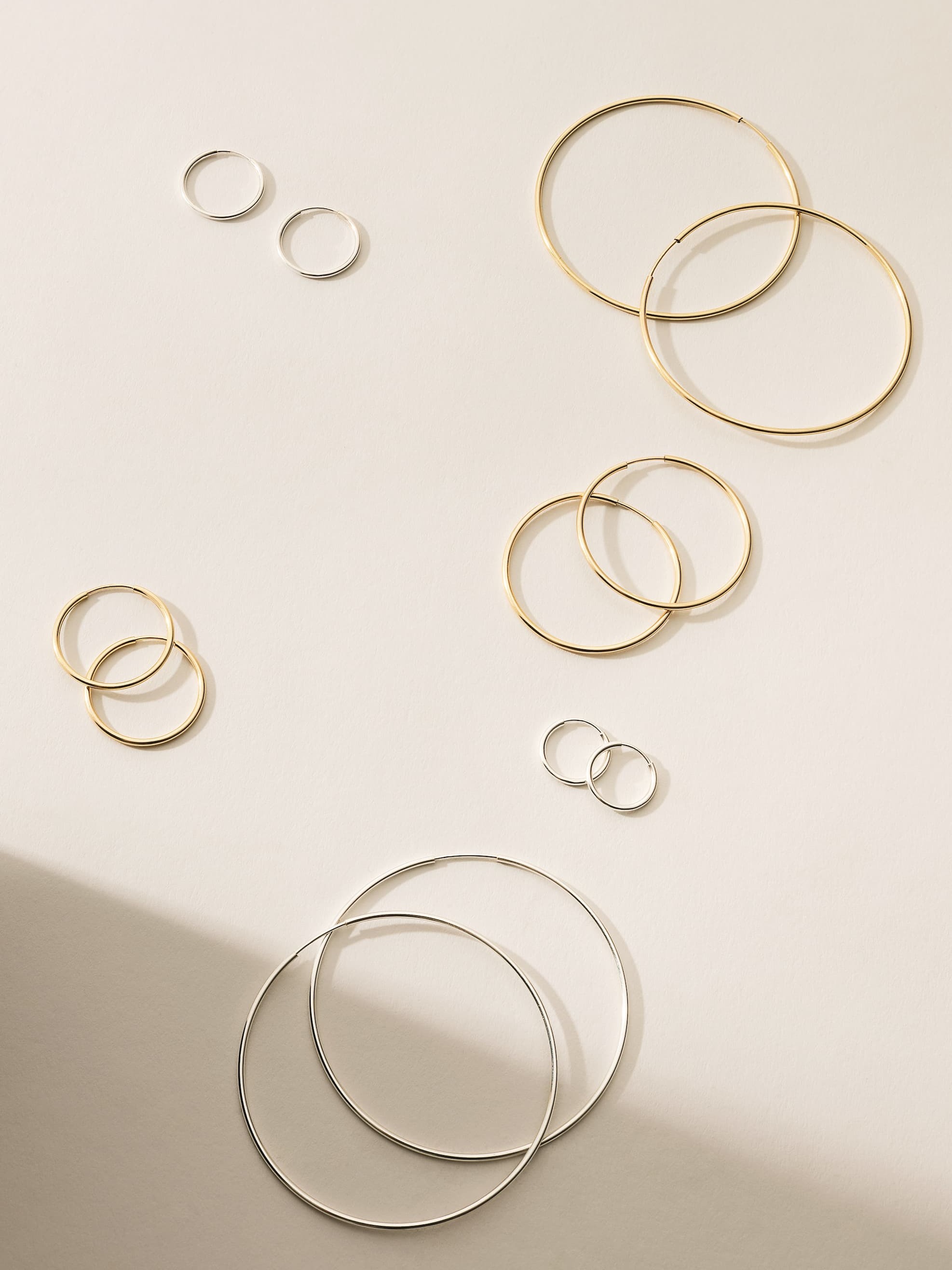 Live in hoops in silver and gold