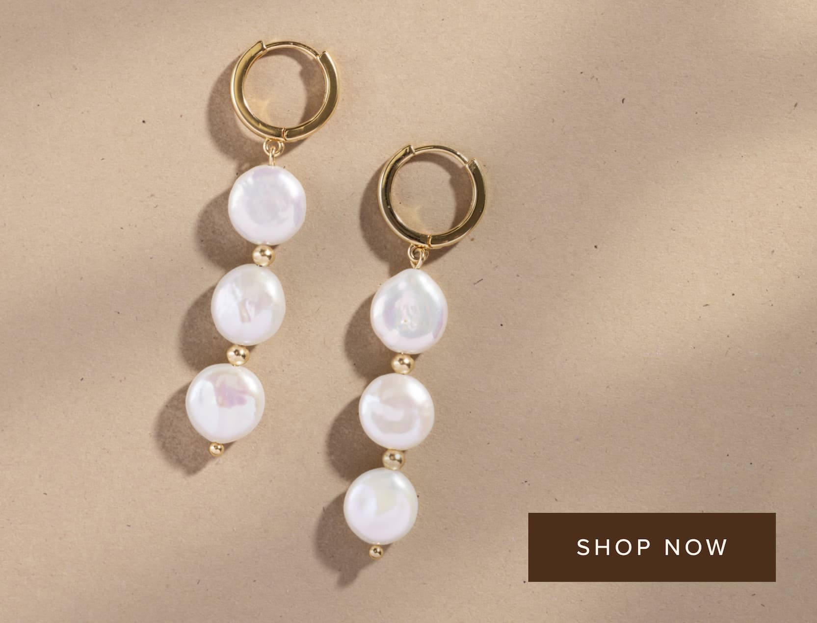 Pearl drop hoop earrings.
