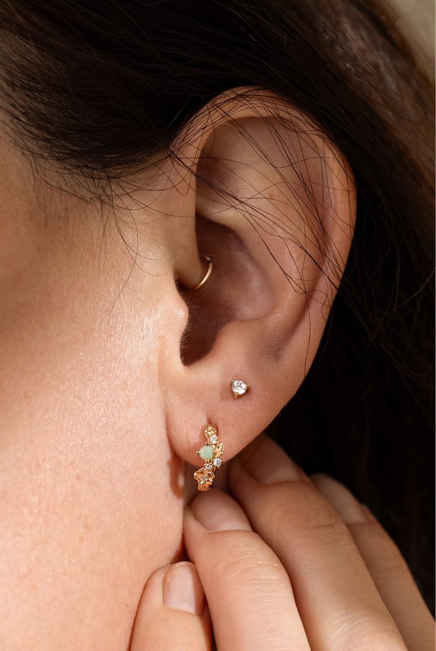 Lumi stud earrings on a model