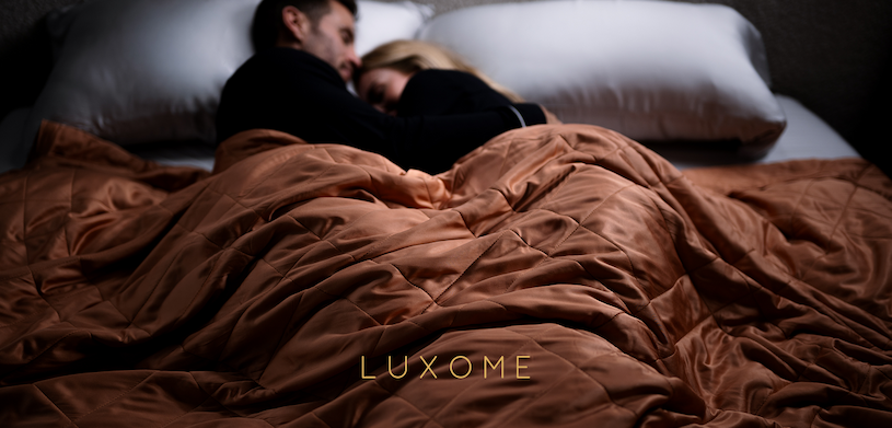 Couple Sleeping Peacefully With Lightweight Blanket