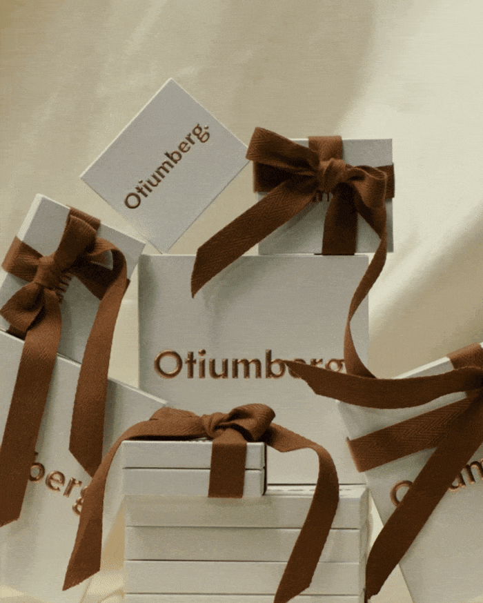 otiumberg gifting boxes with brown ribbon
