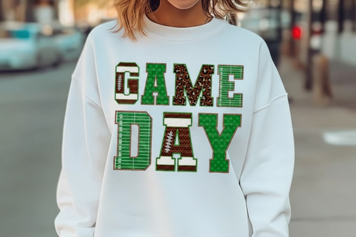 an image of a woman wearing a sweatshirt that says game day