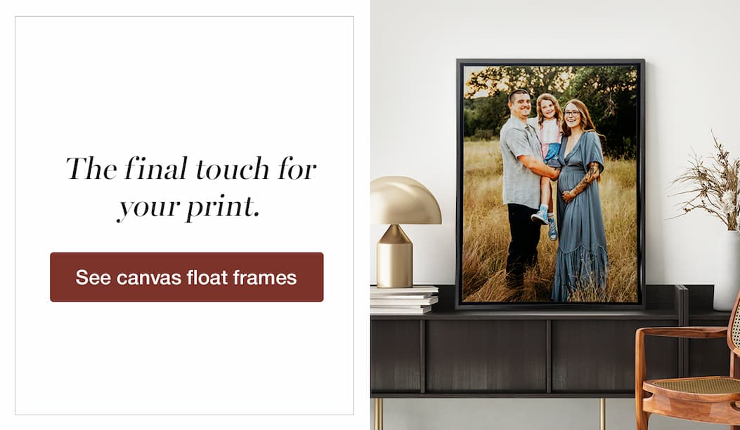 an image of a family portrait displayed on a wall with a vase and lamp